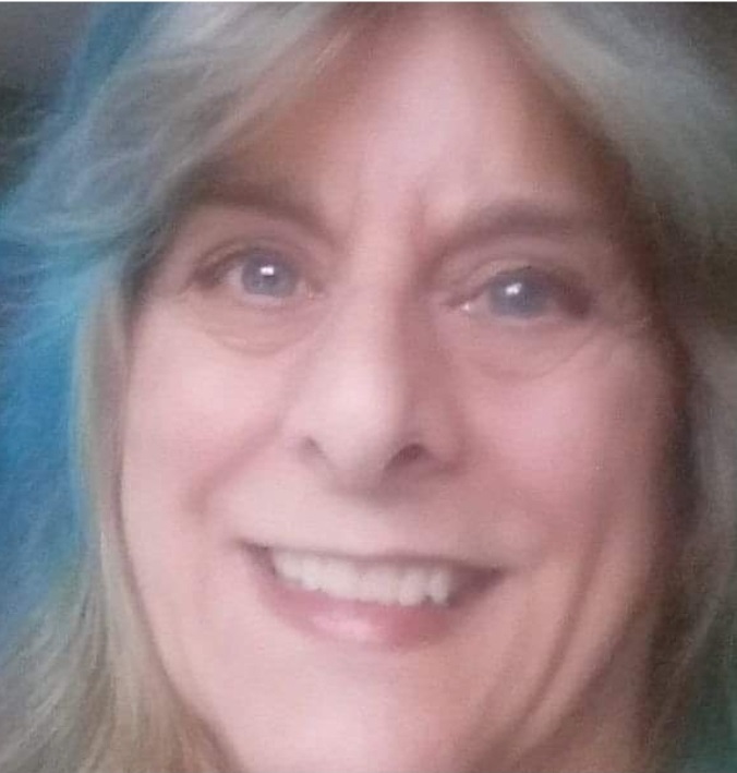 Close up of linda's face with blue/blonde hair