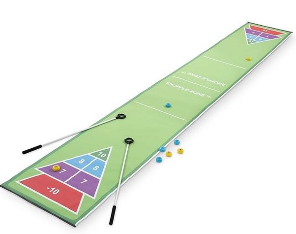 Shuffle board field with pucks and pushers.