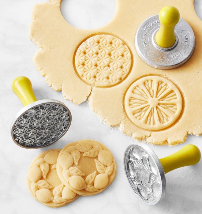 Cookie stamps with fruit and honybee patterns.