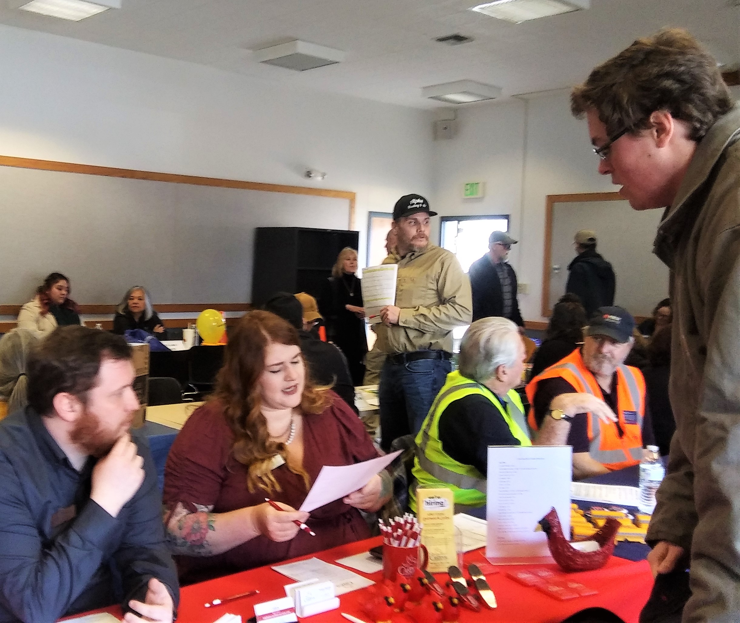 Job seekers and employers discussing employment opportunities at the Coos Bay Library.