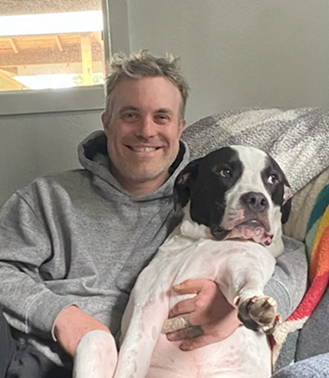 Josh with his big white and black dog