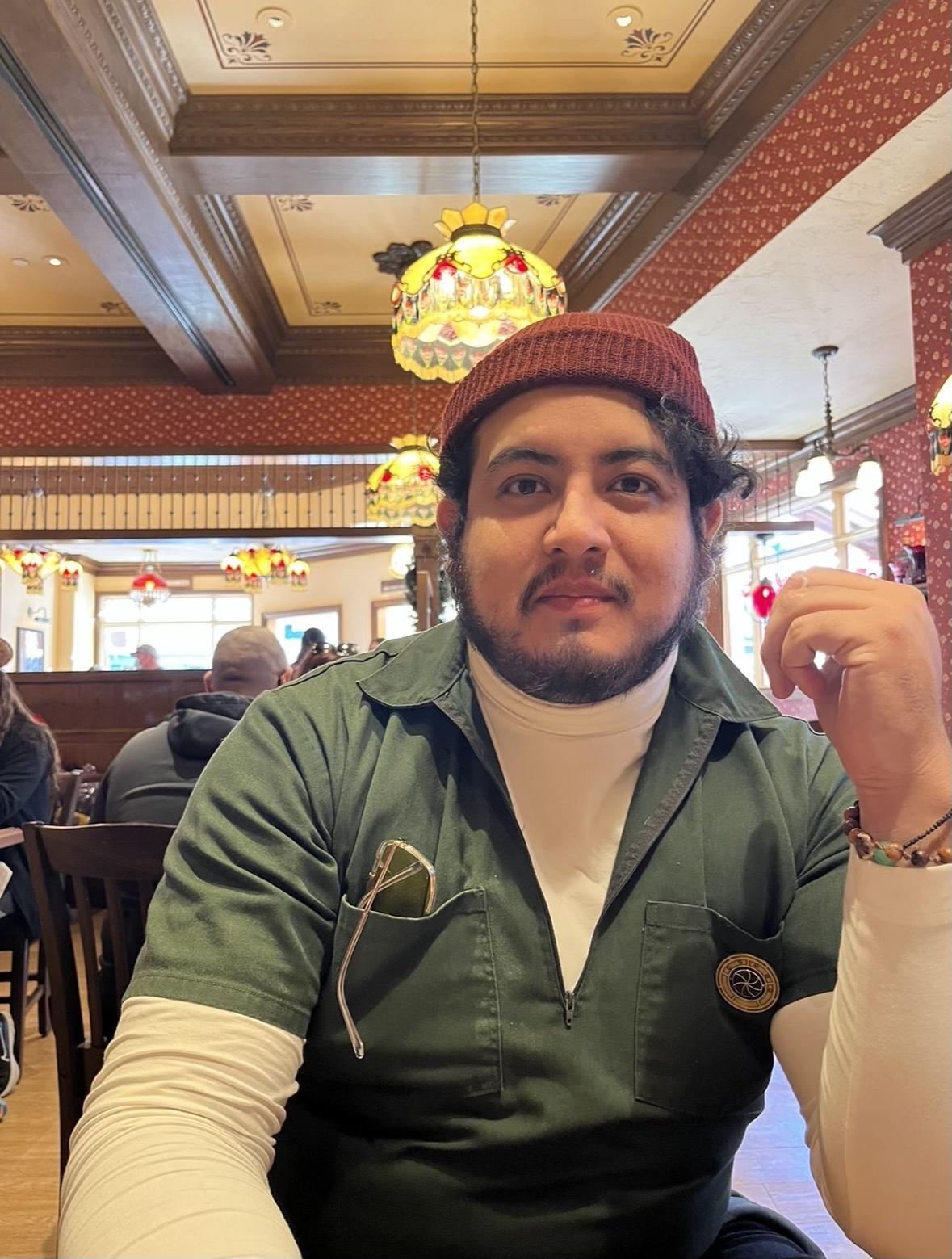 Gene sitting at table in restaurant