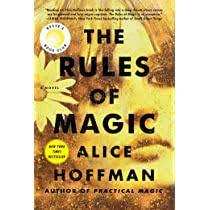 A woman's face in close up, a floer over her ear. all in shades of yellow.