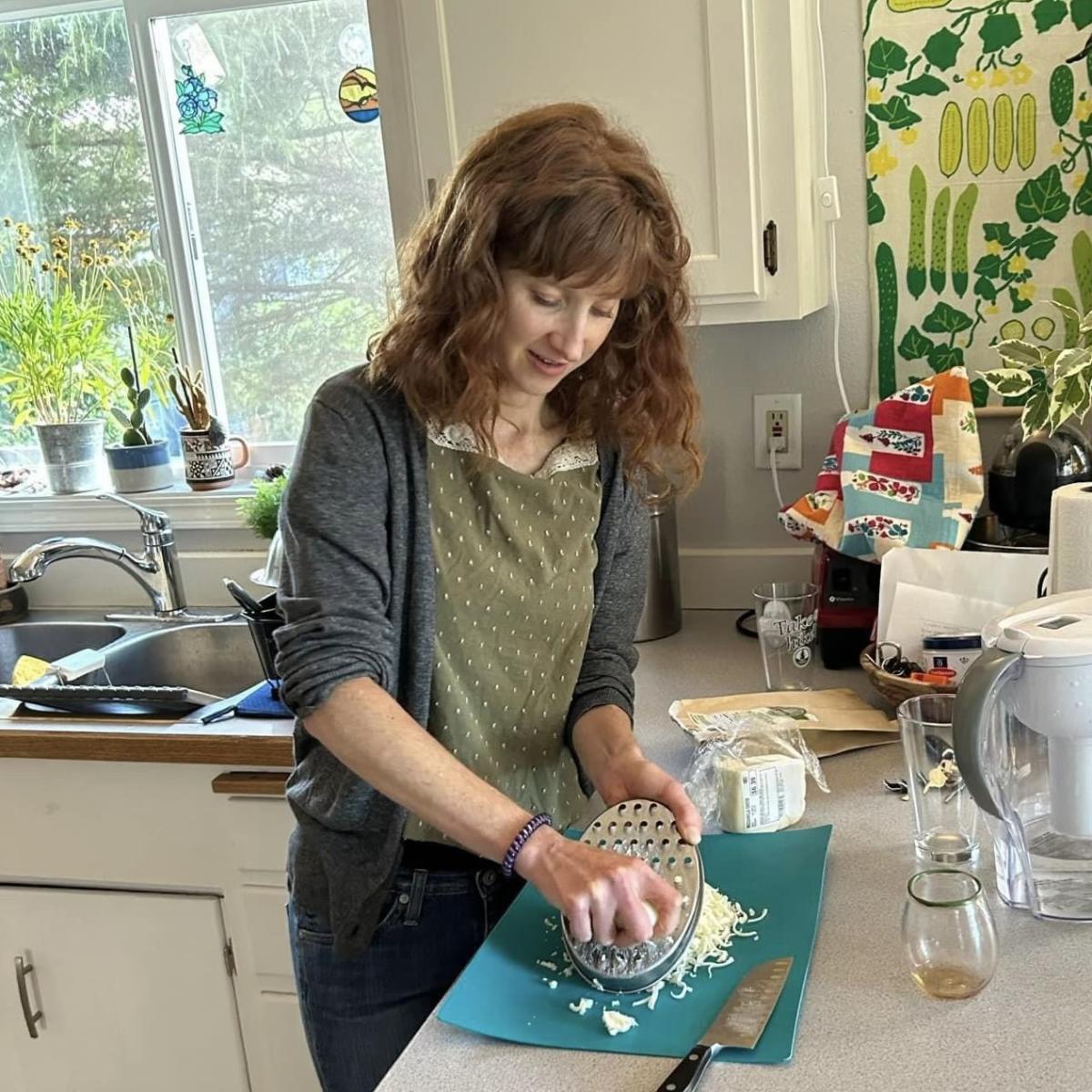 Kelli prepping a meal in her kitchen