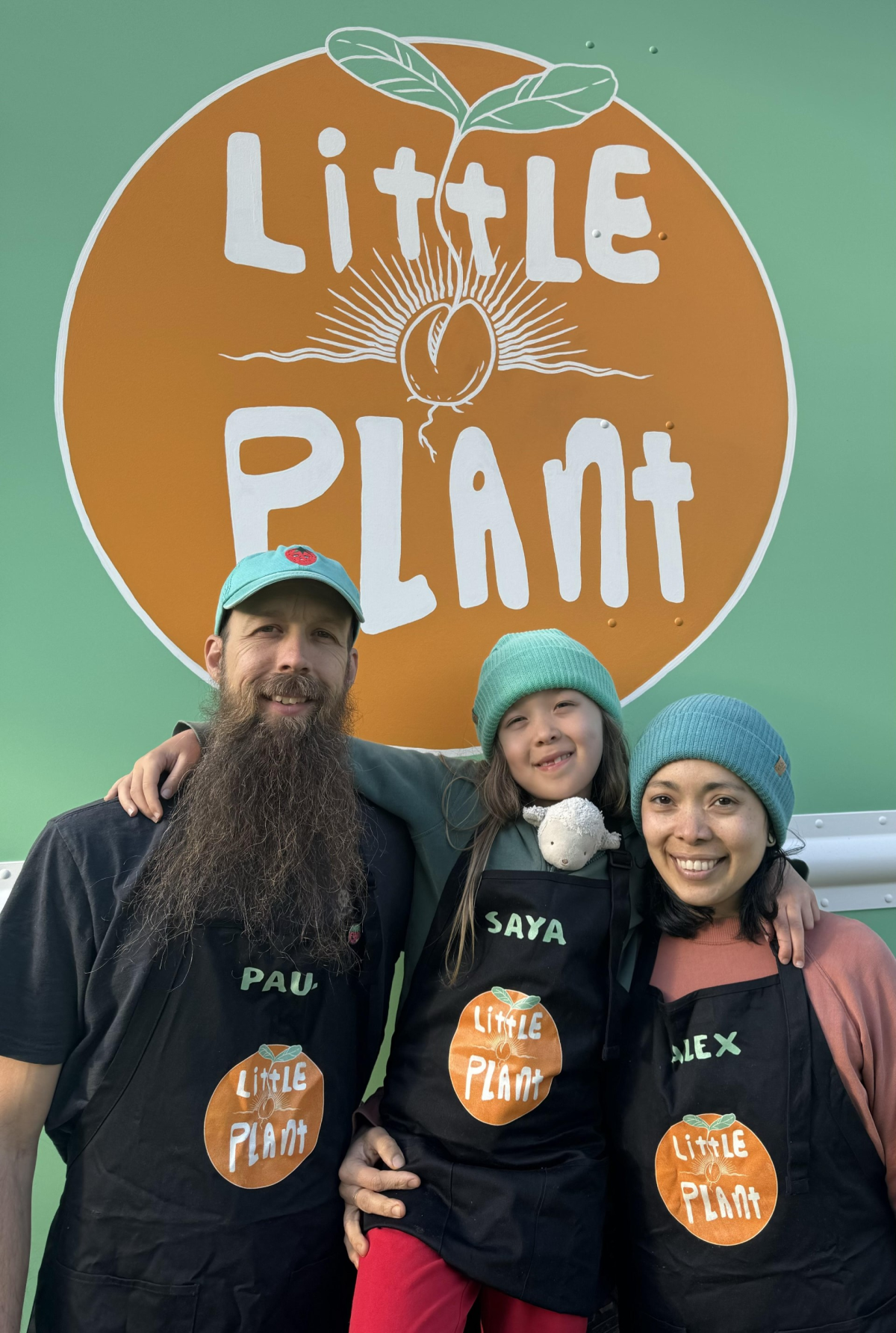 Little Plant Food Truck's Alex, Paul, and Saya in front of their truck