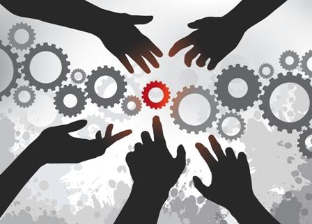 hands reaching for interlocking cogs